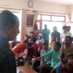 Officer giving information about master plan to people in Jageshwar
